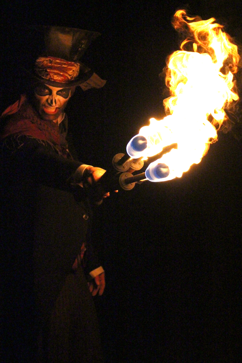 Fire Entertainer, Fire Entertainment, Fire Side Shows and Fire Jugglers and Fire Spinners from The Joker Entertainment at Public Events and Weddings, great for Christmas entertainment, bonfire night entertainment and Halloween entertainment in the Midlands, Nottinghamshire, Lincolnshire, Rutland, Northamptonshire, South Yorkshire and Derbyshire
