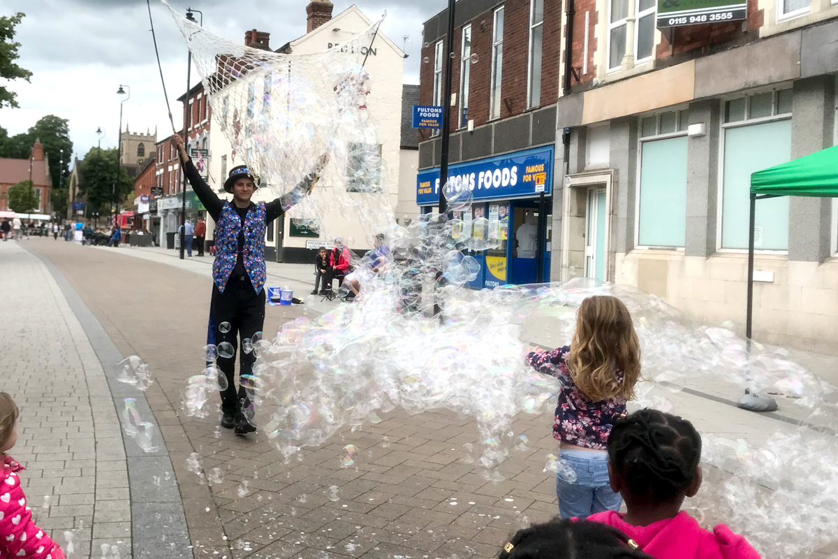 Bubble Entertainer blowing bubbles at your event, some the largest bubble you have ever seen blown by a bubbolagist using the biggest bubble blowers