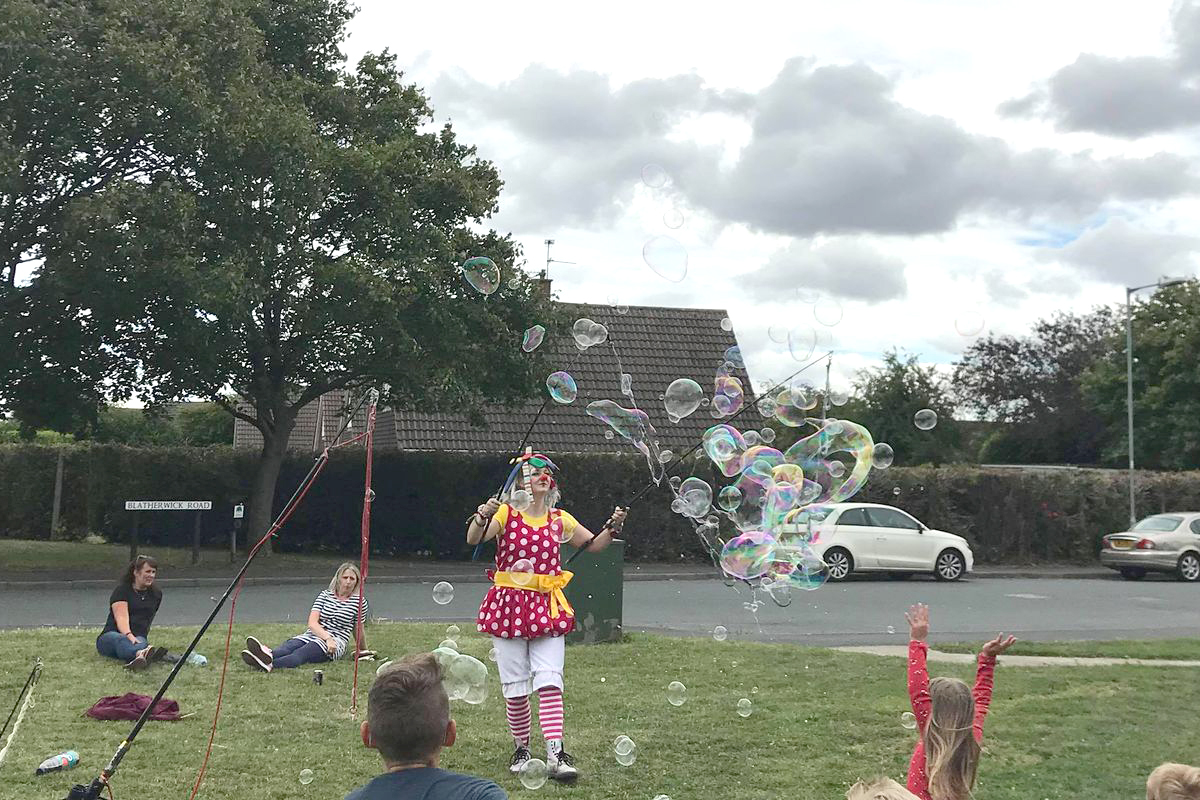 Bubble Entertainer blowing bubbles at your event, some the largest bubble you have ever seen blown by a bubbolagist using the biggest bubble blowers